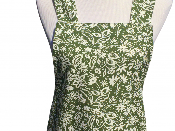 Women's Green & White Floral Cross Back Apron fabric closeup