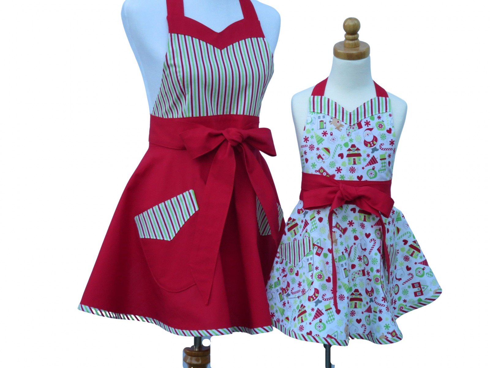 https://www.stitchedbybeverly.com/sites/stitchedbybeverly.indiemade.com/files/imagecache/im_clientsite_product_zoom/mother_daughter_christmas_holiday_retro_style_apron_set_front_views_tied_in_front.jpg