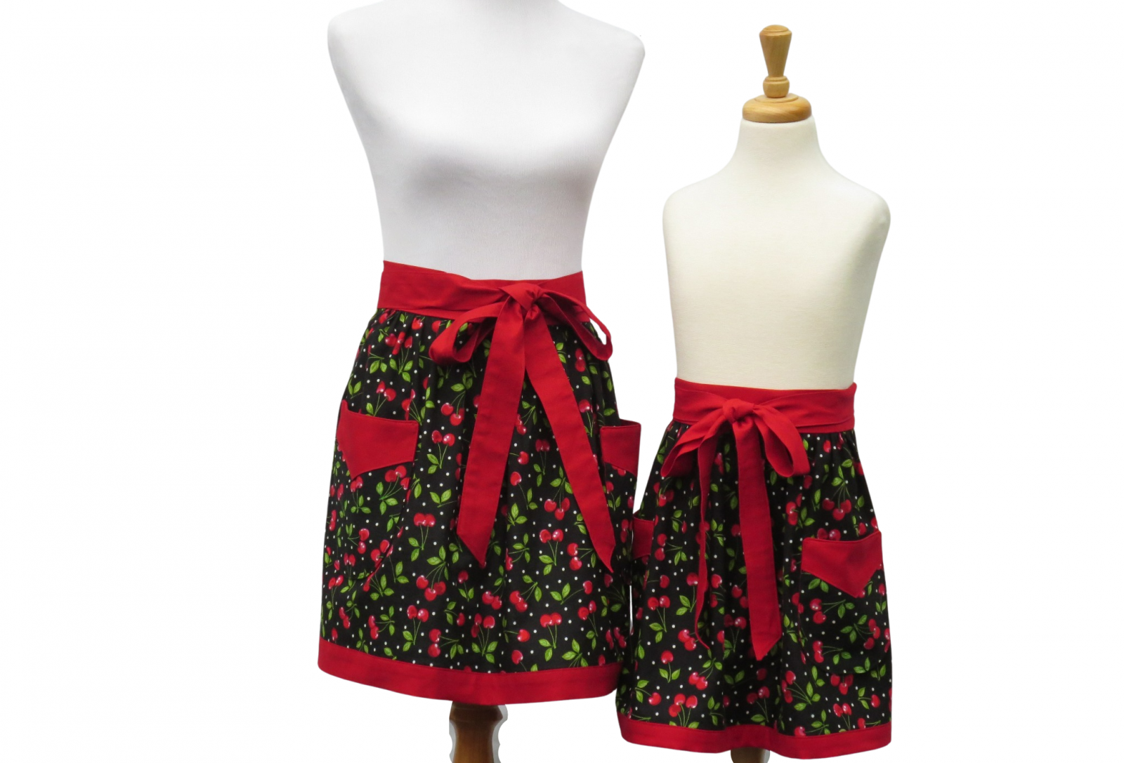 https://www.stitchedbybeverly.com/sites/stitchedbybeverly.indiemade.com/files/imagecache/im_clientsite_product_zoom/mother_daughter_matching_cherries_half_aprons.jpg